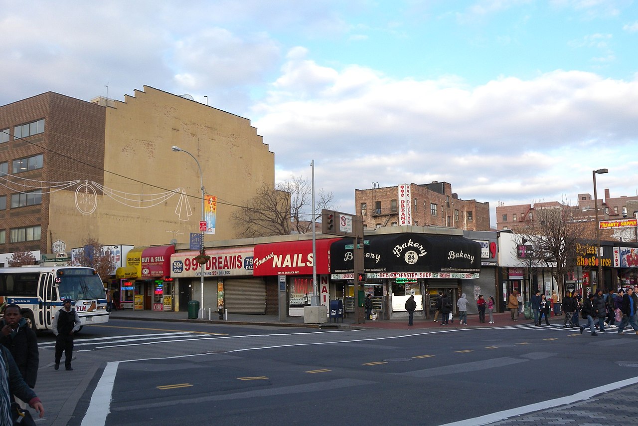Looking northeast across Jamaica Avenue at Sutphin Blvd on a mostly cloudy afternoon