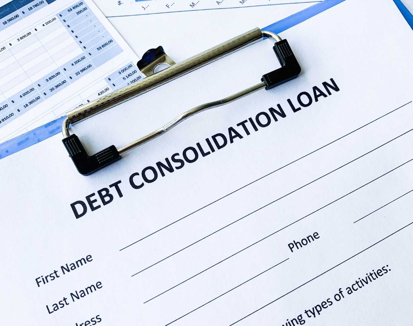 Financial advisor explaining debt consolidation in Jamaica, NY during a client consultation