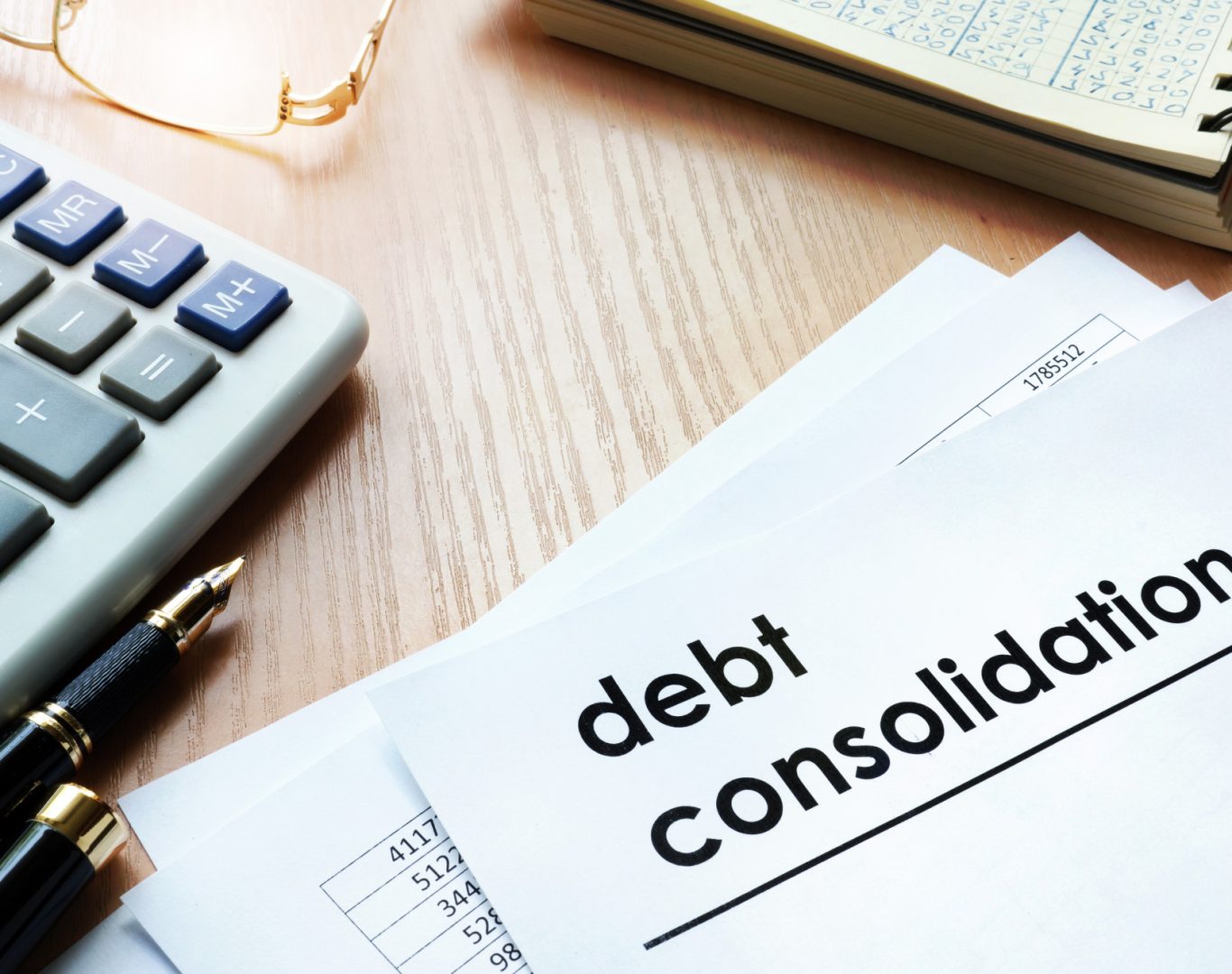 Documents with title debt consolidation on an office table